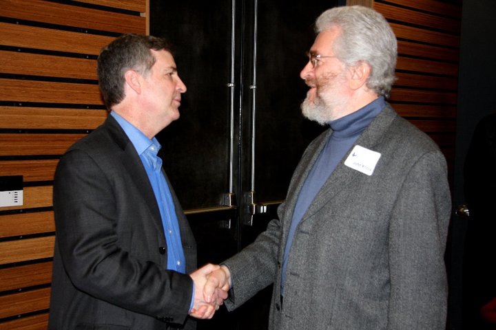 John and Mark Roosevelt shake hands in 2011.